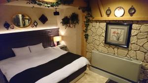 Llit o llits en una habitació de Hotel Birthday Kakamigahara