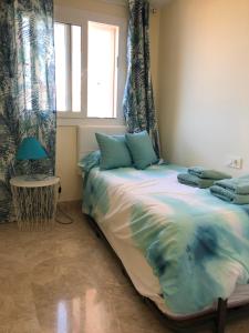 Posteľ alebo postele v izbe v ubytovaní Puerto Fino Apartamentos