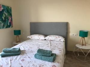 Posteľ alebo postele v izbe v ubytovaní Puerto Fino Apartamentos