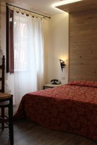 Giường trong phòng chung tại Albergo Al Castello