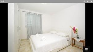 Posteľ alebo postele v izbe v ubytovaní Apartments Marija Max