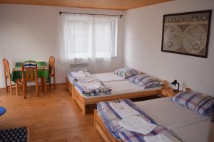 Postel nebo postele na pokoji v ubytování Penzion Slunečno