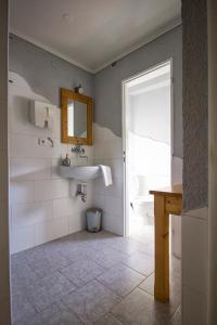 a bathroom with a sink and a toilet at Pension U Přístavu in Pomezí nad Ohří