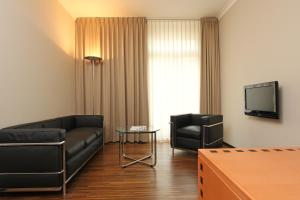 TV in/ali zabaviščno središče v nastanitvi GLANDON Rooms Elite