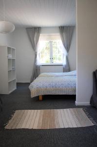 Säng eller sängar i ett rum på Fredensborg Guesthouse