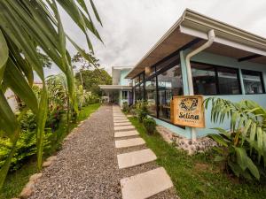 a walkway in front of a building at Selina La Fortuna in Fortuna