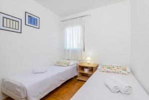 Postel nebo postele na pokoji v ubytování Villa Nika