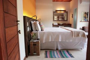 
Cama ou camas em um quarto em Vila Barracuda Boutique Hotel
