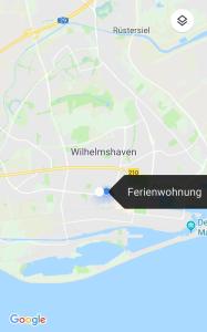 a map of the city of waterholm with a black marker at Ferienwohnung Maritim mit E-Bike Verleih in Wilhelmshaven