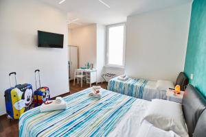 Postel nebo postele na pokoji v ubytování BB HomEitaly Civitavecchia + 37 fotografií