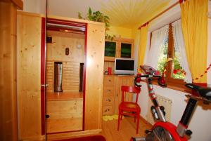 a room with a home office and a bike in it at Haus Tasser in Mayrhofen
