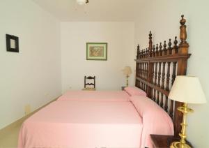 A bed or beds in a room at New Andalusian House 33 Free Private Parking