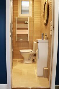 a small bathroom with a toilet and a sink at StayLib - NICE FLAT 2 ROOMS in Asnières-sur-Seine