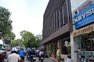 a group of people riding bikes down a street at Phu Tho Hotel in Ho Chi Minh City