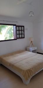 Uma cama ou camas num quarto em Colibri Beach Villas