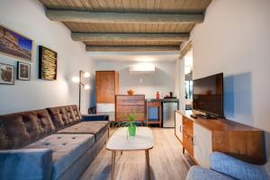 a living room with a couch and a table at El Vado Motel in Albuquerque