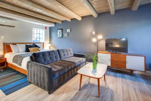 a living room with a couch and a bed at El Vado Motel in Albuquerque