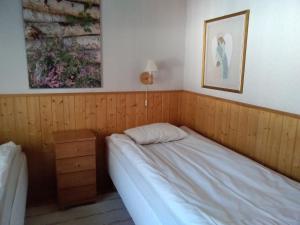 Postel nebo postele na pokoji v ubytování Hotelli Möhkön Rajakartano - Ilomantsi