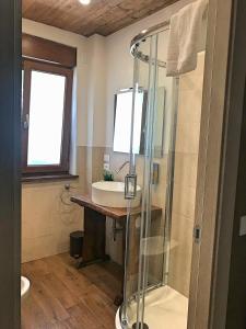 a bathroom with a glass shower and a sink at Perla della Sila B&B in Lorica +43 photos