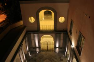 an empty hallway of a building at night at Villa Avellino Historic Residence in Pozzuoli