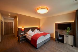 Voodi või voodid majutusasutuse Hotel Gantkofel toas