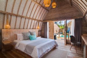 a bedroom with a bed in a room at Gili Meno Escape - Adults Only in Gili Meno
