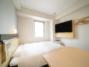 Letto o letti in una camera di Super Hotel Tokyo Shiba
