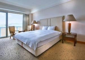Gulta vai gultas numurā naktsmītnē Hotel Hyundai by Lahan Mokpo