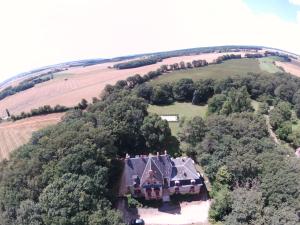 an aerial view of a large house in a field at chateau du ponthereau in Massay
