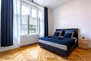 Posteľ alebo postele v izbe v ubytovaní Avantguard Apartments