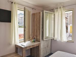 TV a/nebo společenská místnost v ubytování A casa di Noemi
