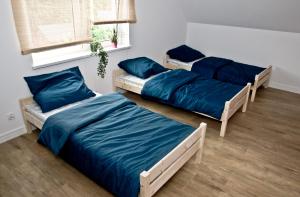 Ліжко або ліжка в номері Noclegi ul. Jędrusiów