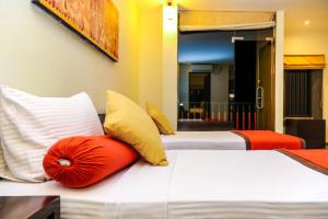 Postel nebo postele na pokoji v ubytování Oak Ray City Hotel + 26 fotografií