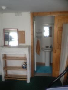 a bathroom with a sink and a toilet at Causeway Coast Independent Hostel in Portstewart