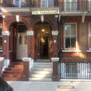 an entrance to a brick building with a white door at The Paramount Hotel in London