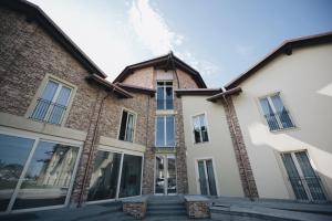 an exterior view of a building with windows at Cascina Speranza Hotel in Riva presso Chieri