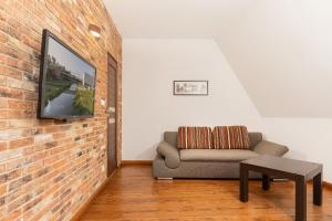 Część wypoczynkowa w obiekcie Apartments Poznań Strzałowa by Noclegi Renters
