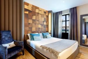 A bed or beds in a room at Hotel Condes de Barcelona
