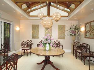 a dining room with a table and chairs at Twenty Nevern Square Hotel in London +72 photos