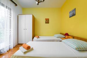 Ένα ή περισσότερα κρεβάτια σε δωμάτιο στο Apartment Bartul
