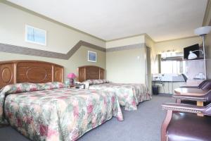 Postel nebo postele na pokoji v ubytování Motel Marie-Dan