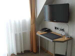 TV a/nebo společenská místnost v ubytování Hotel Gode Wind