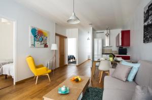 a living room with a couch and a table at Rue du Temple - Le Marais in Paris