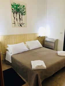 Cama o camas de una habitación en Dimora Il Tiglio- mini appartamenti