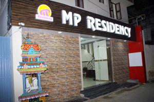a mip restaurant sign on the side of a building at Mp Residency in Kumbakonam