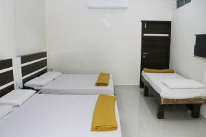 Postel nebo postele na pokoji v ubytování Mp Residency