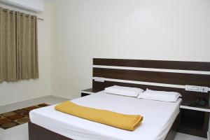 Postel nebo postele na pokoji v ubytování Mp Residency