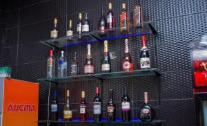 a display of bottles of alcohol on a wall at Residency Hotels Enugu Independence Layout in Enugu