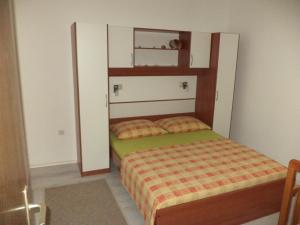 Postel nebo postele na pokoji v ubytování Apartments Mira