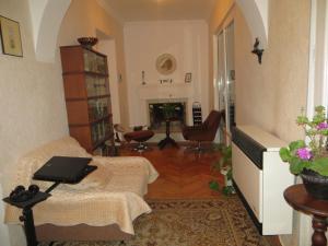 a living room with a couch and a table at Guest House Kamea in Sighnaghi